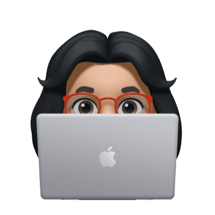 A girl peeking from behind her laptop